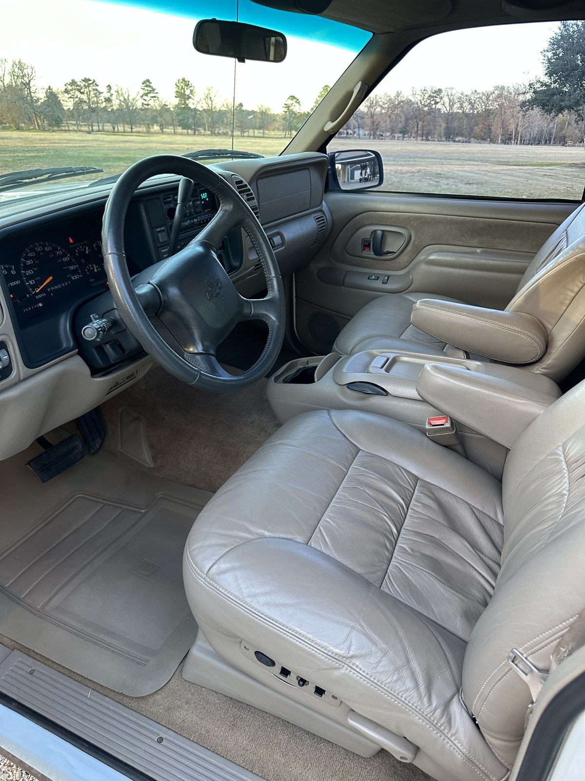 Tan leather interior of a 1998 Chevy pickup